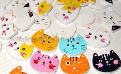 Wooden button in the shape of a cat's head