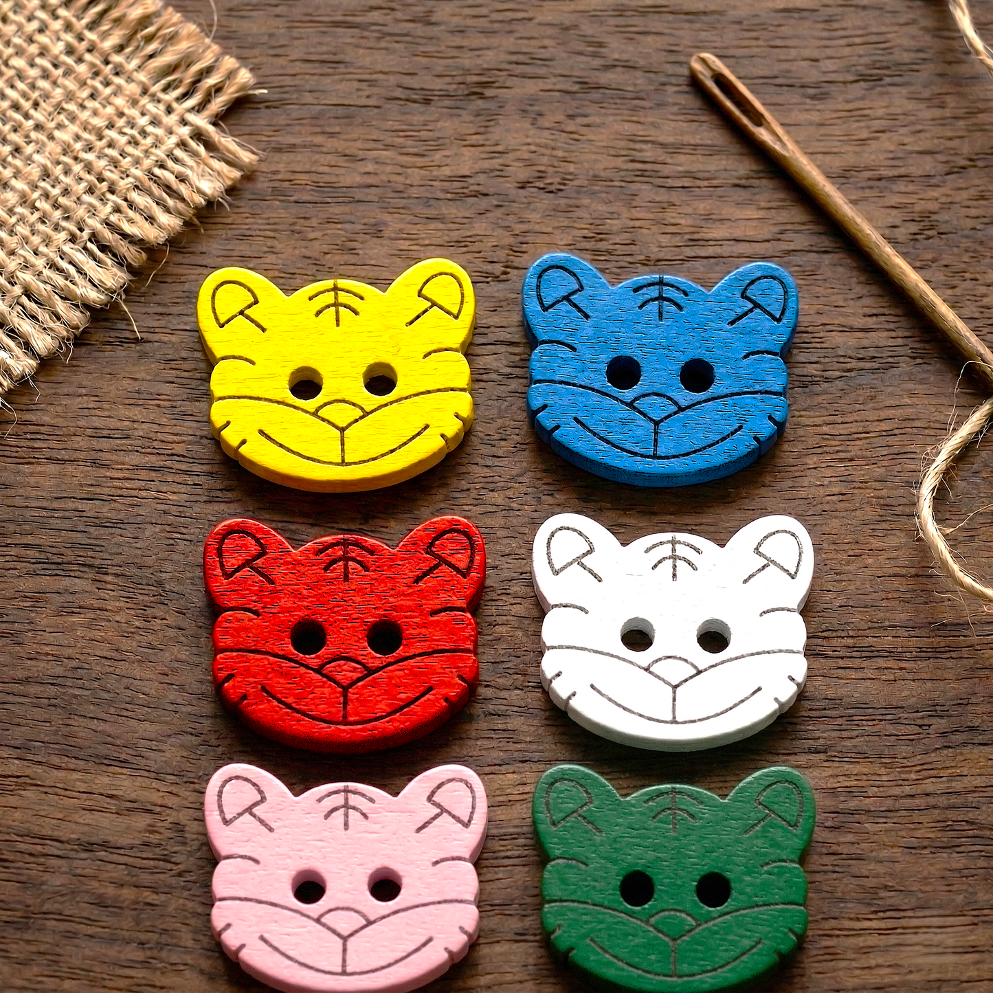 Wooden button in the shape of a cat