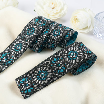 Shiny woven ribbon with floral ornament - 19mm