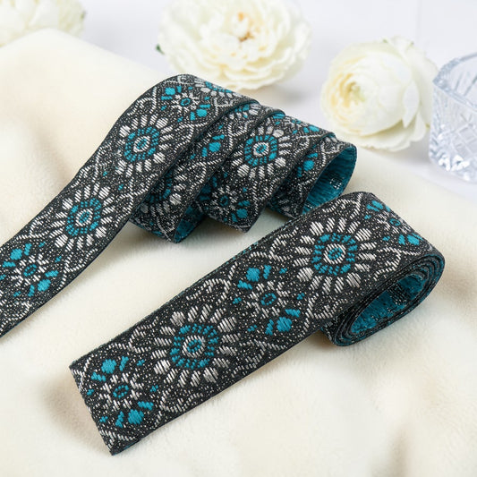 Shiny woven ribbon with floral ornament - 19mm